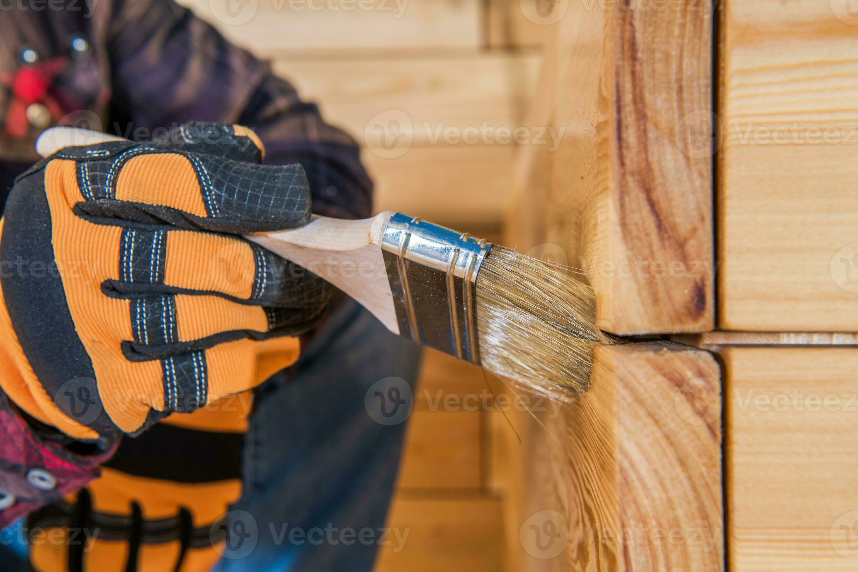 Men Oiling Wooden Planter To Protect Wood From Weather Elements 24635420 Stock Photo at Vecteezy