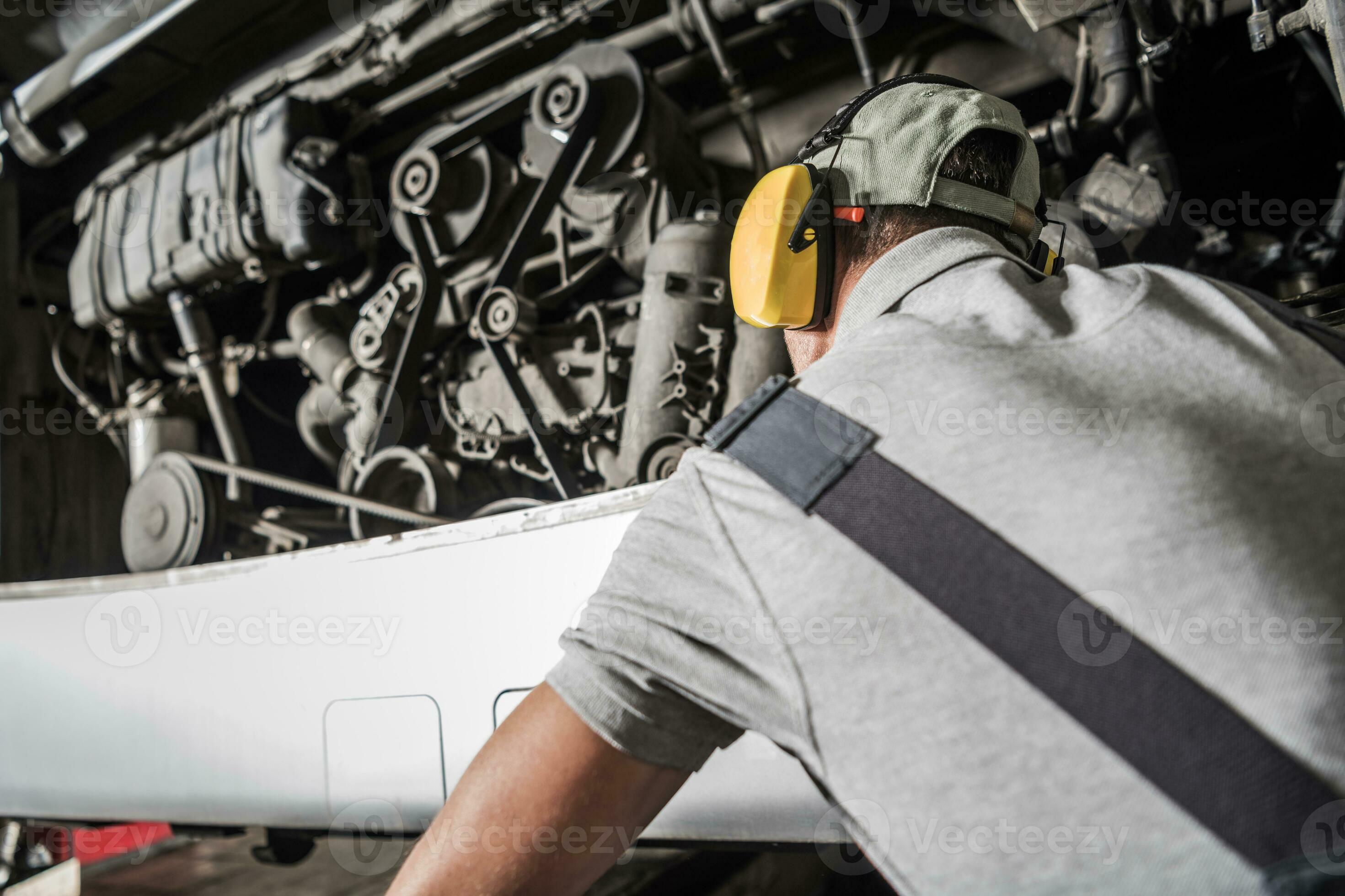 Diesel Technician Looking Inside Bus Engine Compartment 24635585 Stock