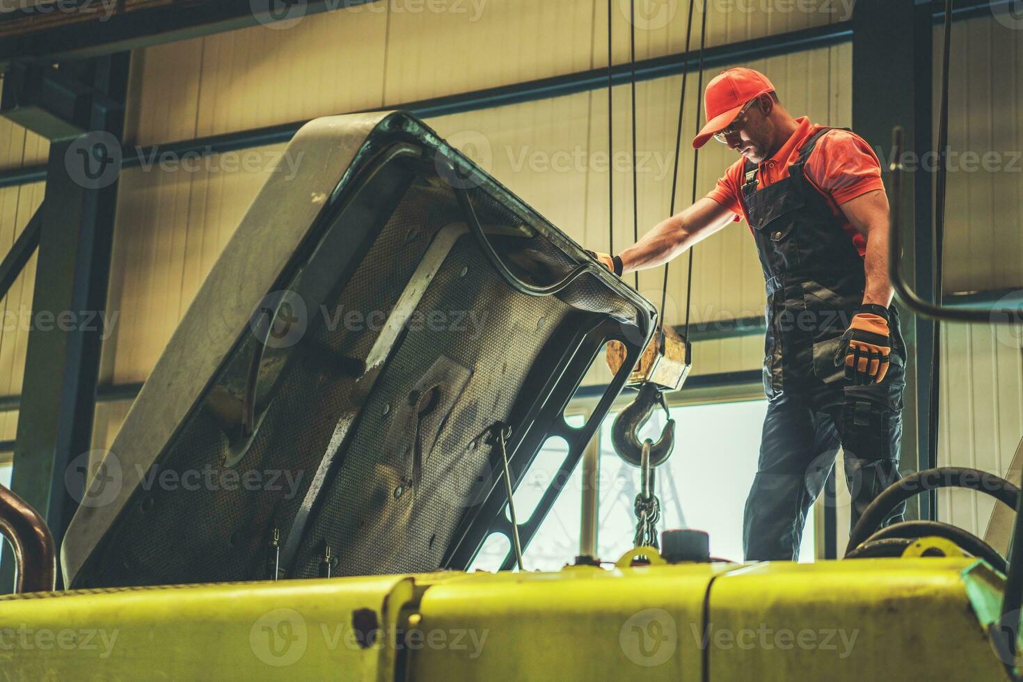 Mechanic Repairing Excavator photo