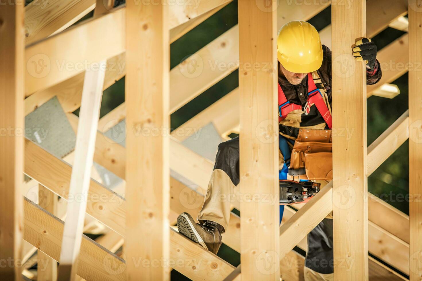 Man Working at Height at the Construction Site photo
