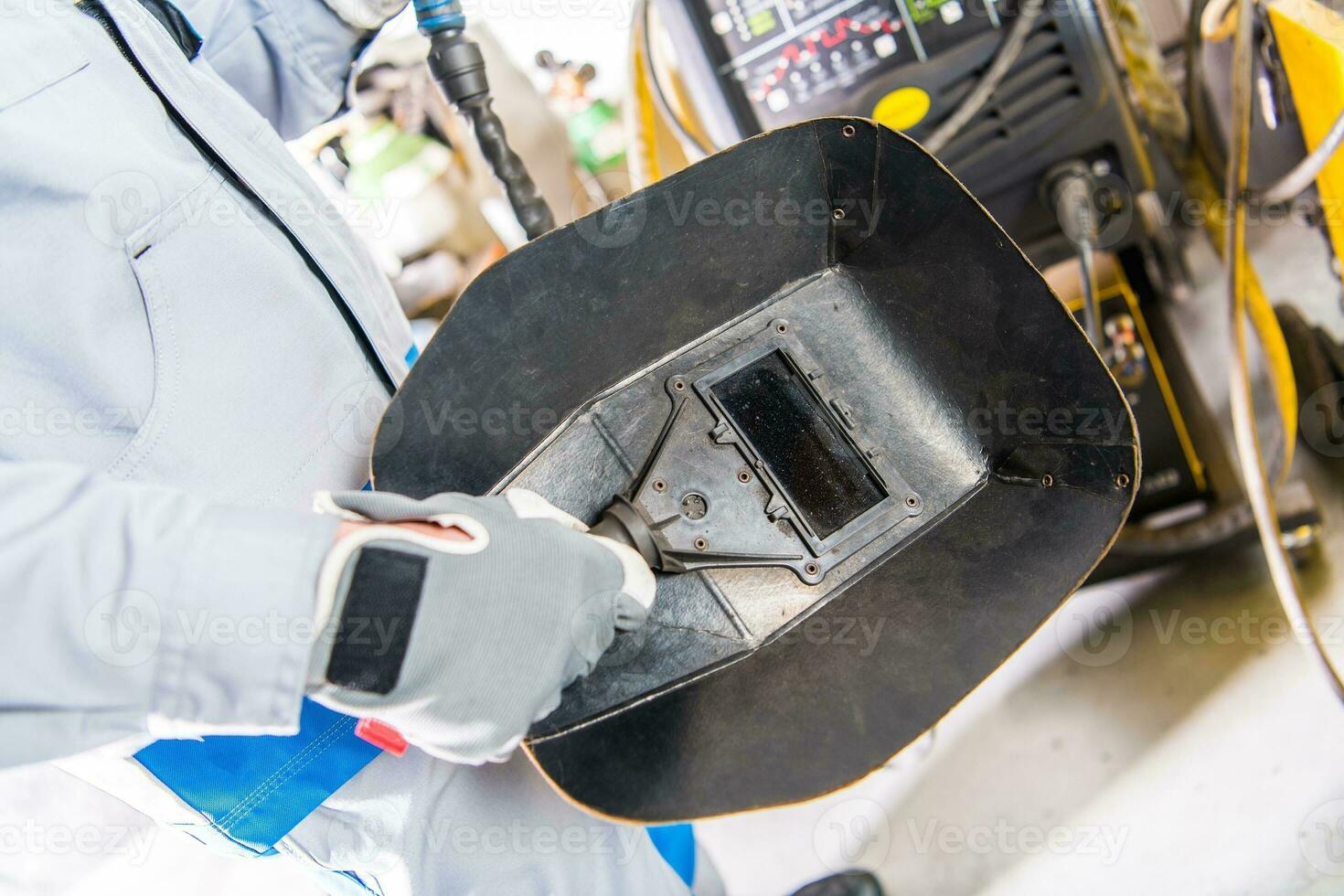 Welding Mask in a Hand photo