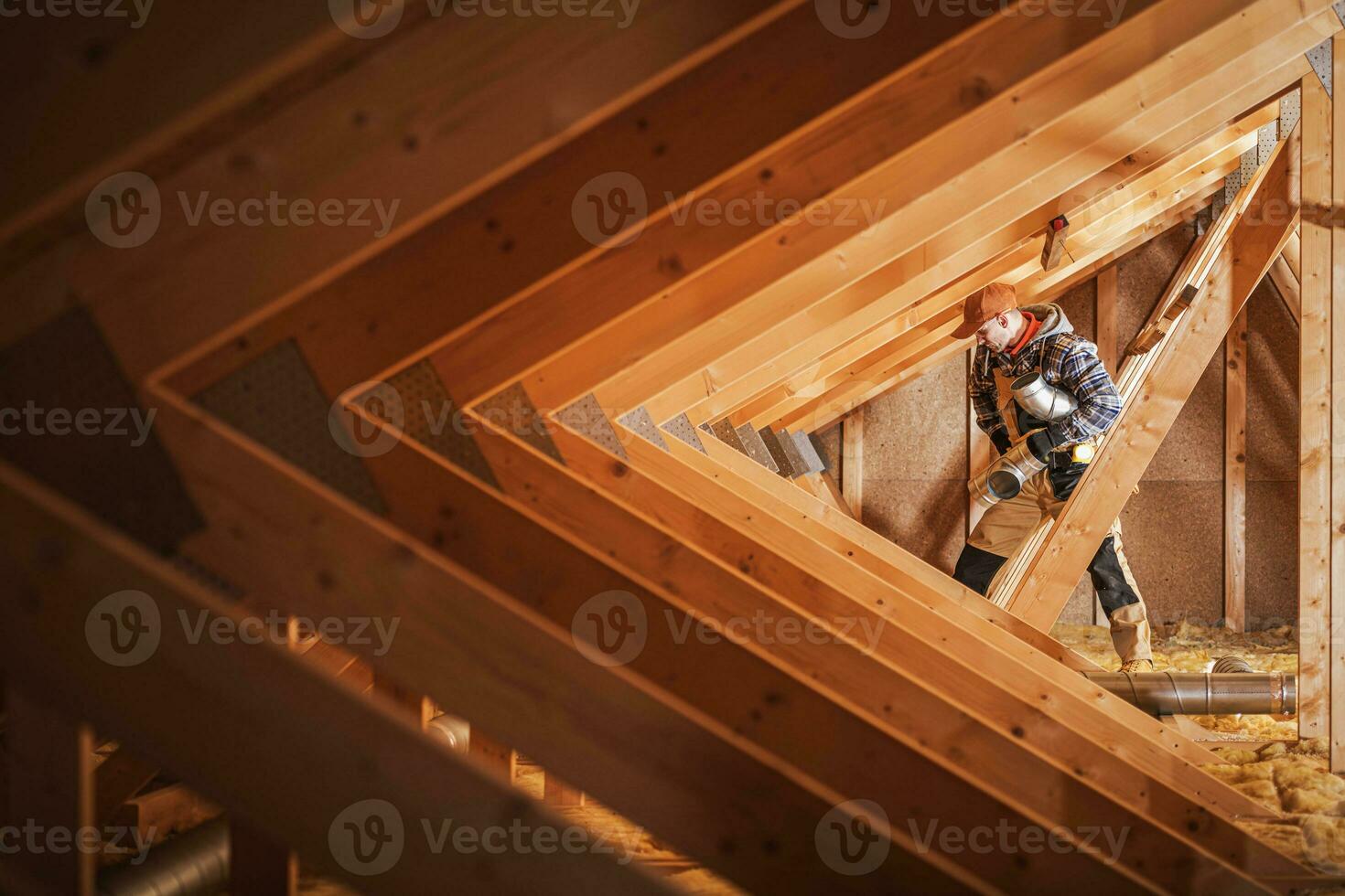 Construction Worker Performing Ventilation Ducts Installation photo