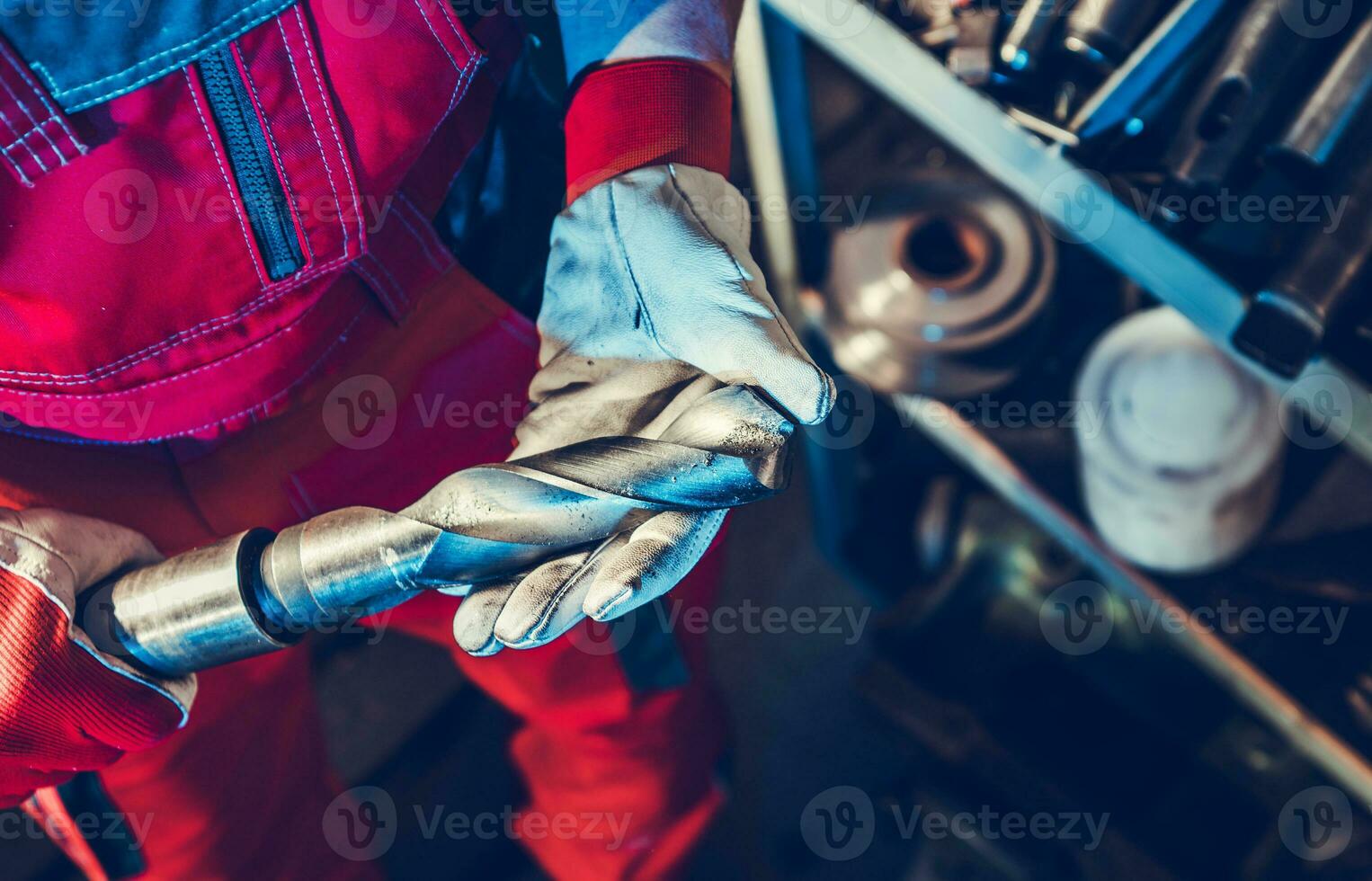 Metalworking Technician with Large Drill Bit in His Hands 24636941