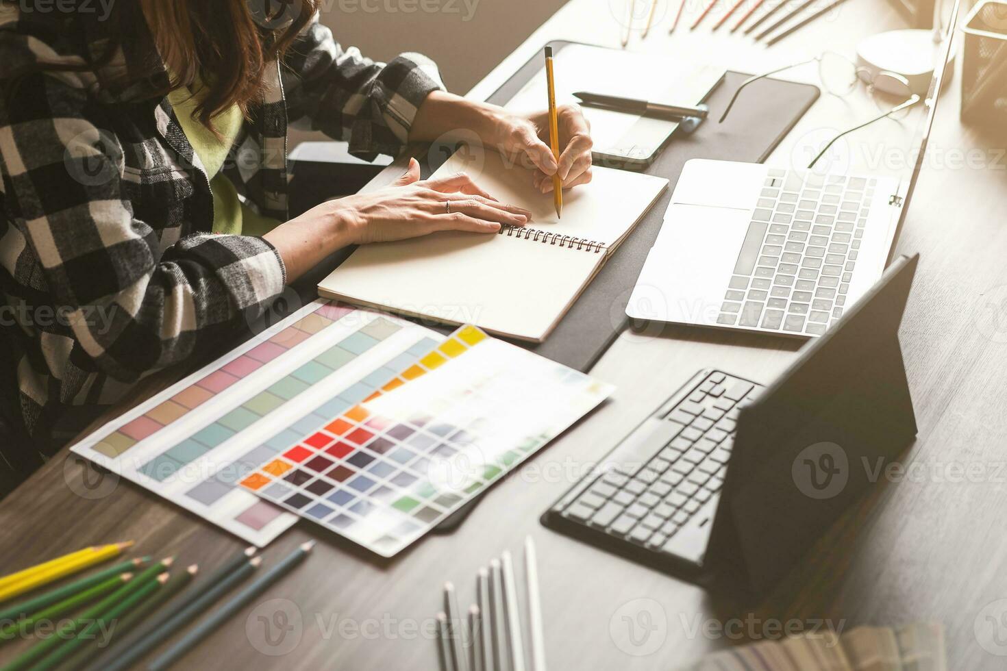 Graphic designer working with sketching logo design at office. photo