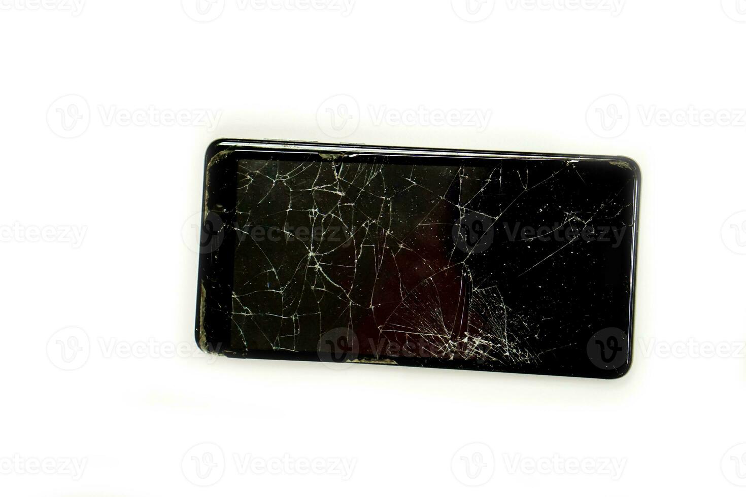 Top view broken and pull down of black mobile phone isolate on white background. photo