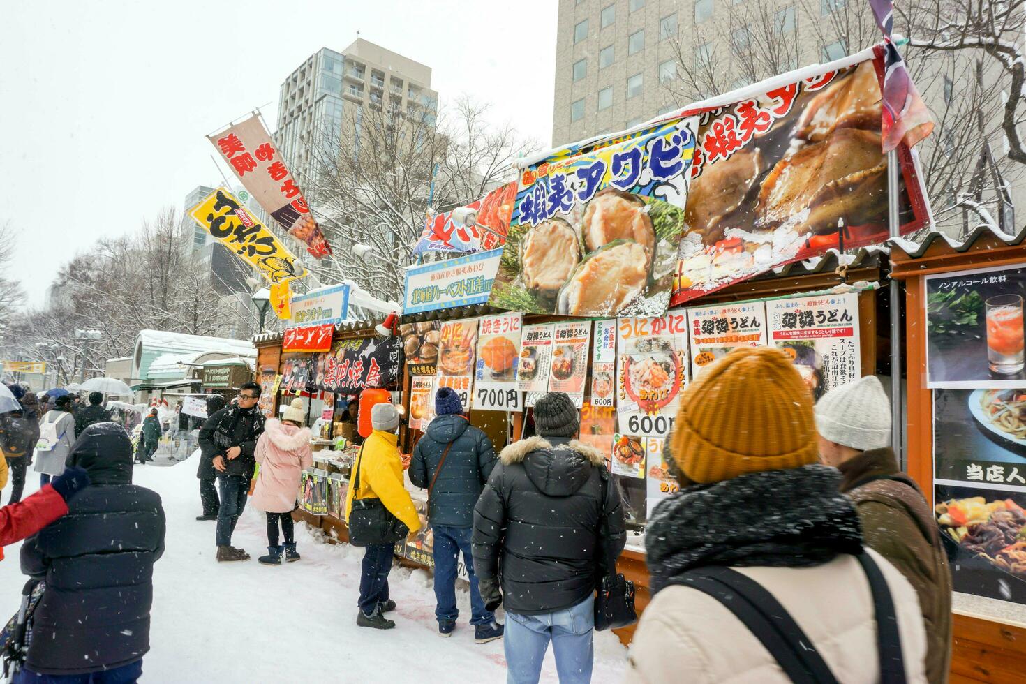 Supporo, Hokkaido, Japan 2018- Booth sell a variety of food at the Snow  Festival, It has attracted many tourists and Japanese come to visit amid  heavy snow. 24643419 Stock Photo at Vecteezy