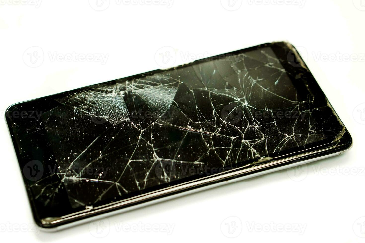 Closeup broken and pull down of black mobile phone isolate on white background. photo