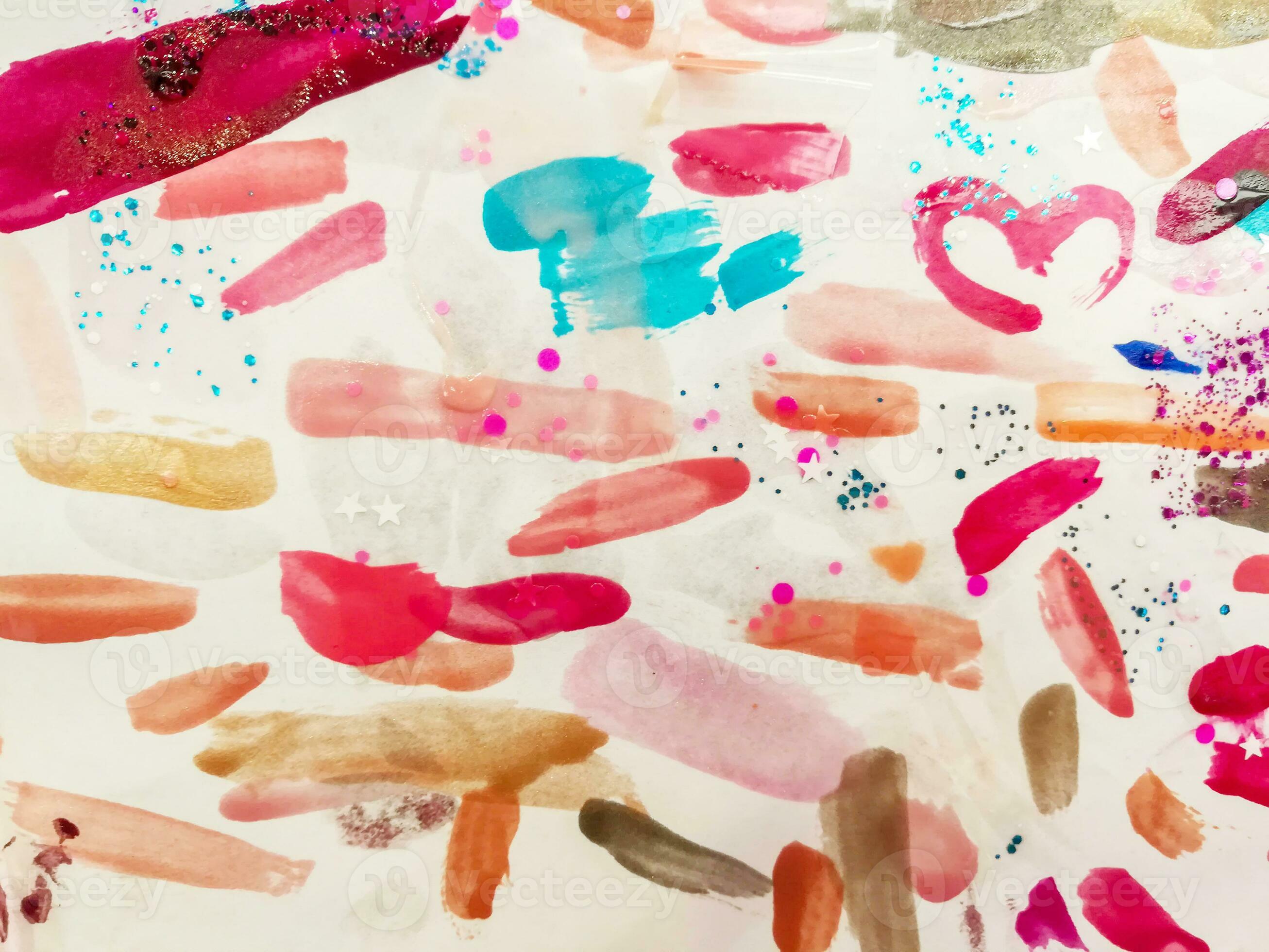 Colorful fingernail paint of customer testing on white paper background