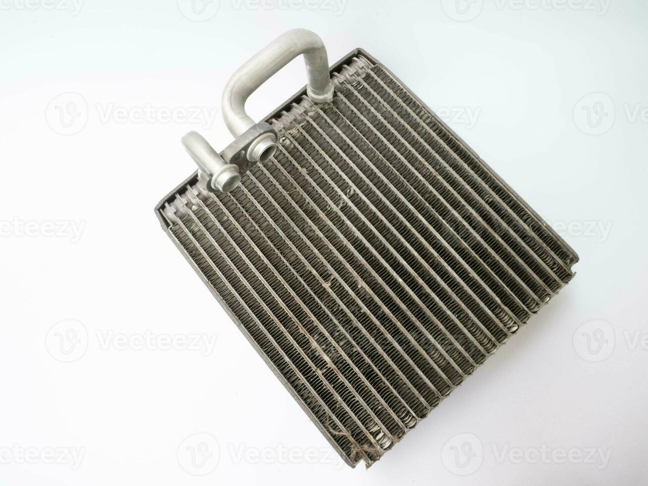 Broken air conditioner coil of a car on a white background. 24643818