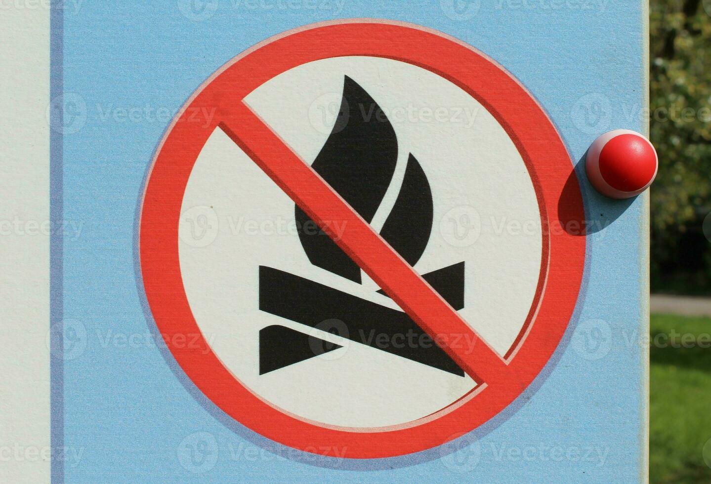 No camp fire sign. Sign which shows its prohibited to make a fire here. Bush fire season - no open flame out doors. No fire on the beach. Light cold colors - clear sign. High resolution image photo