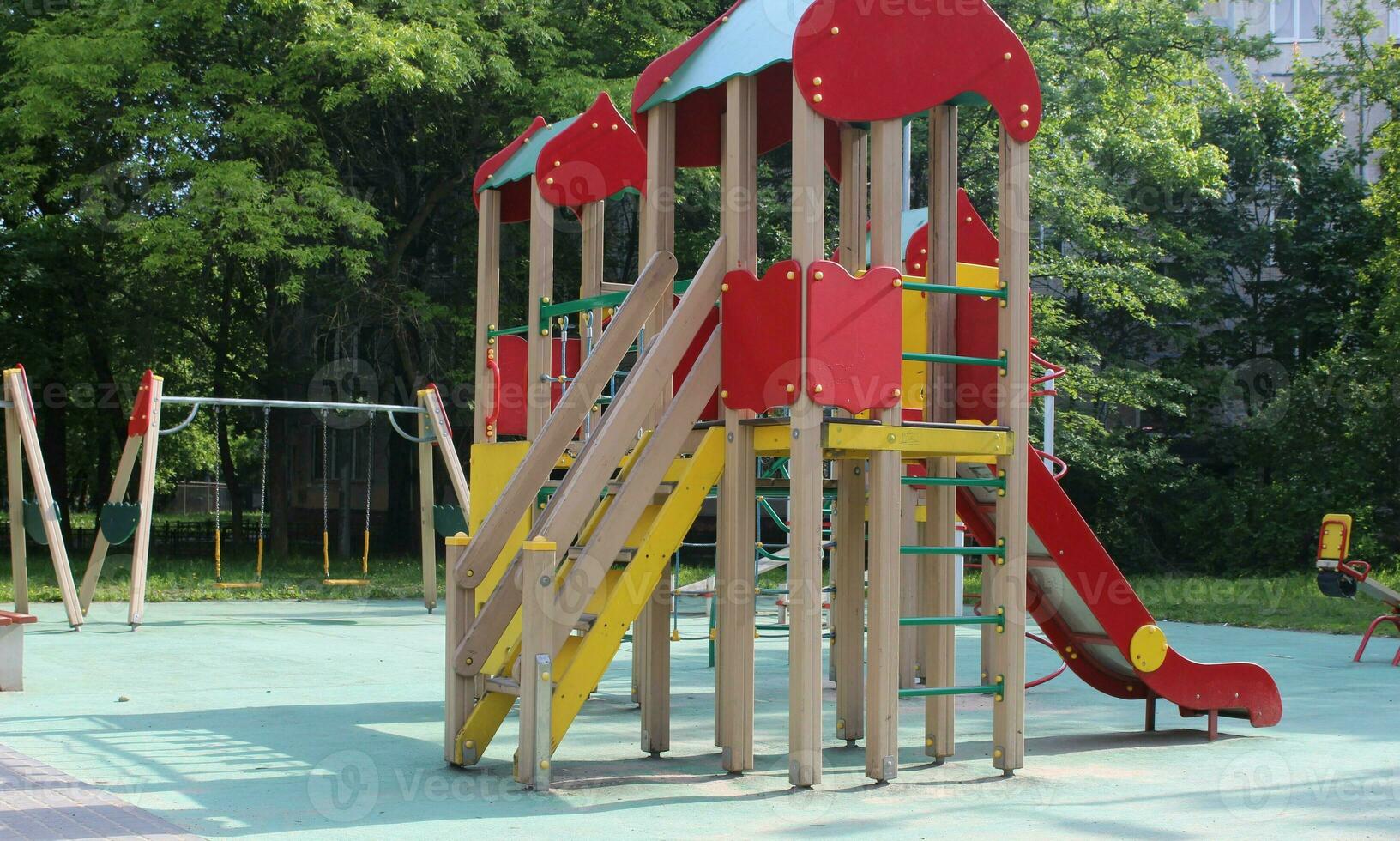 Shaded kid's playground activity tower equipment photo