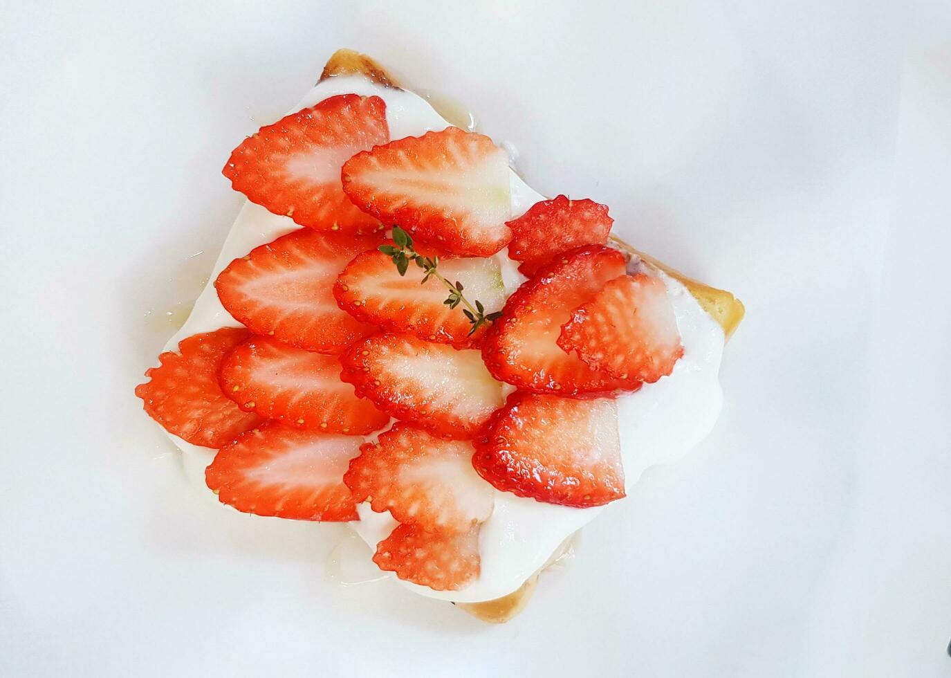 Top view or Flay lay of Fresh and Sweet Strawberry cream toast isolated on white paper. selective focus, Dessert food and Fresh fruit photo