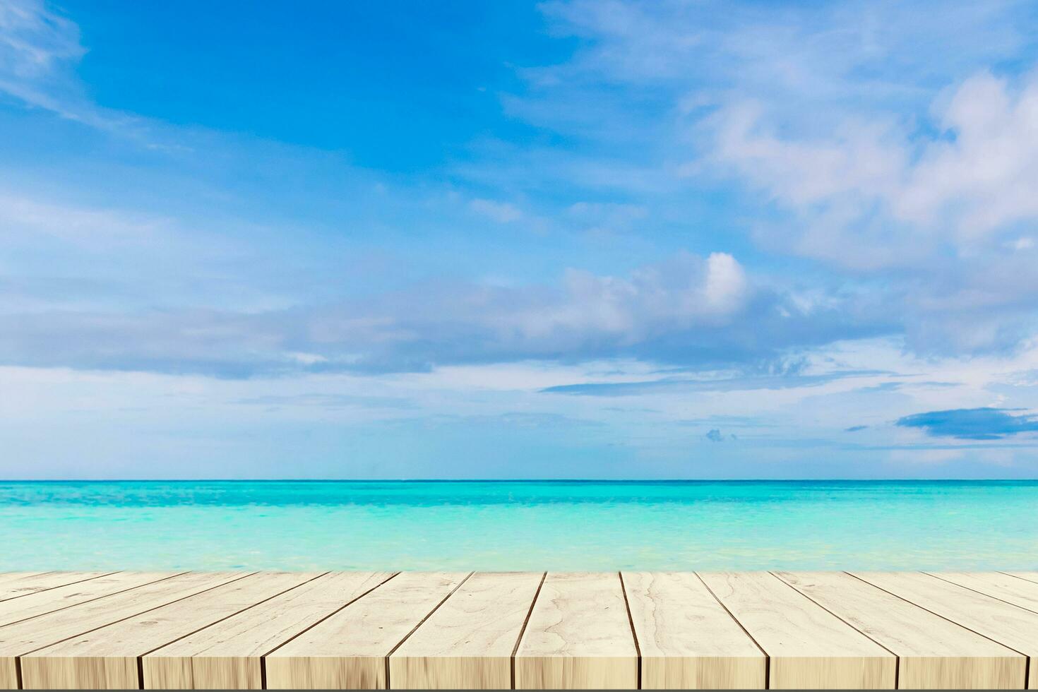 Top of wood balcony table with seascape and palm leaves, sea and sky at beach photo