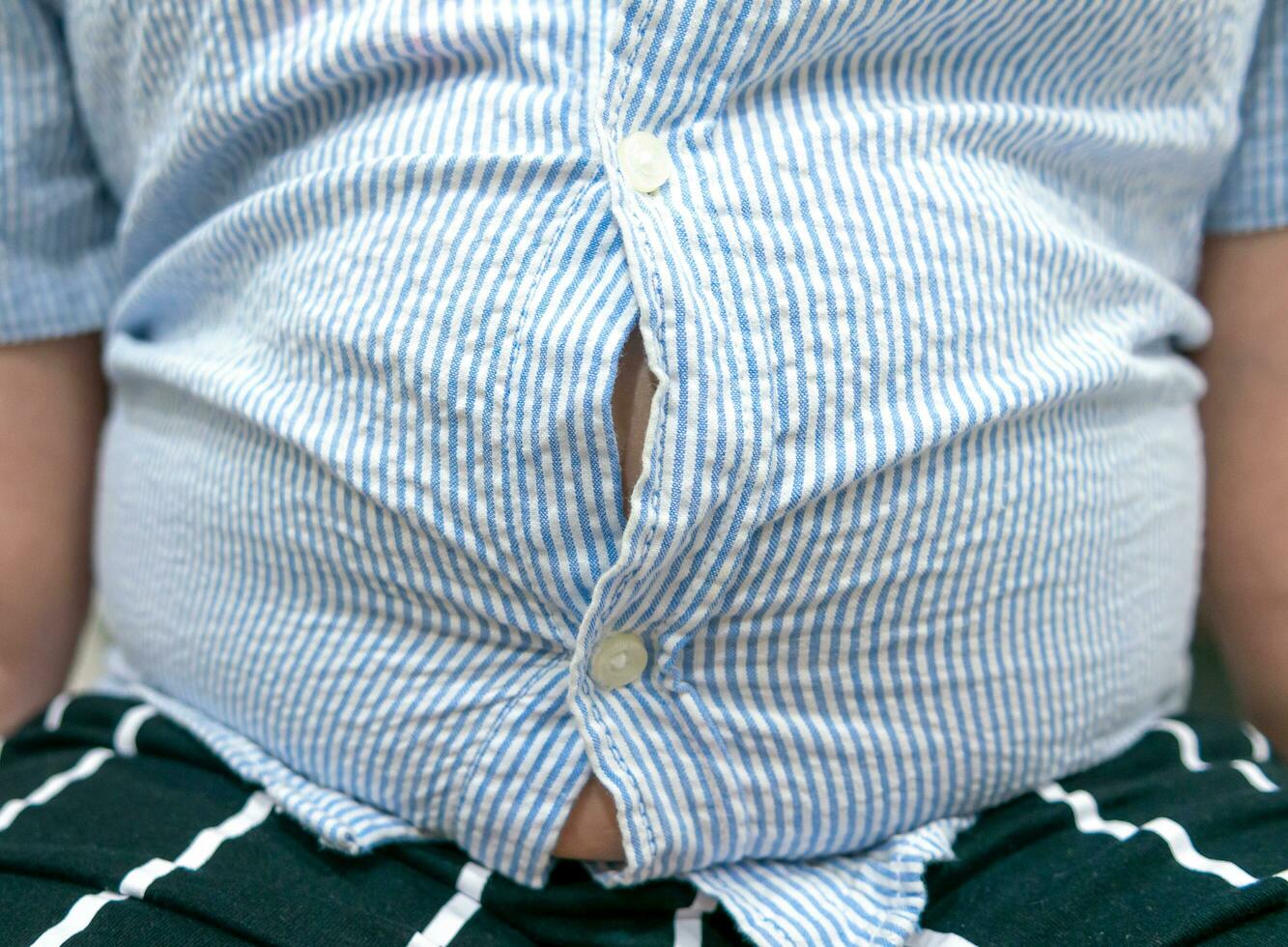 Tight shirt of obese fat boy overweight. photo