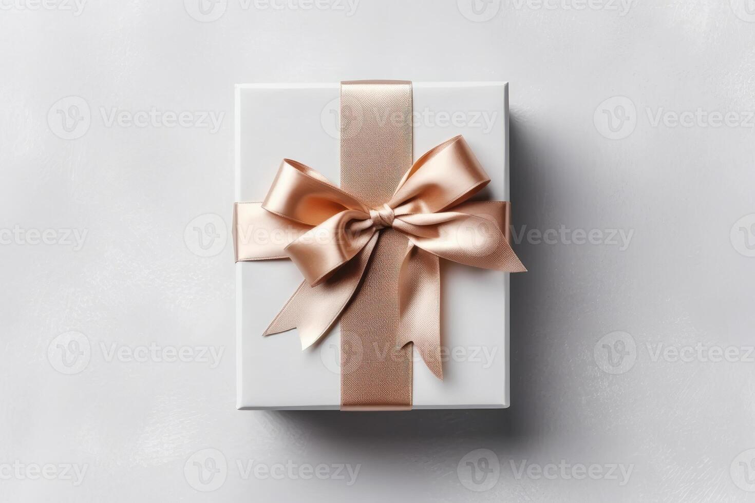 Gift box with satin ribbon and bow on white background photo