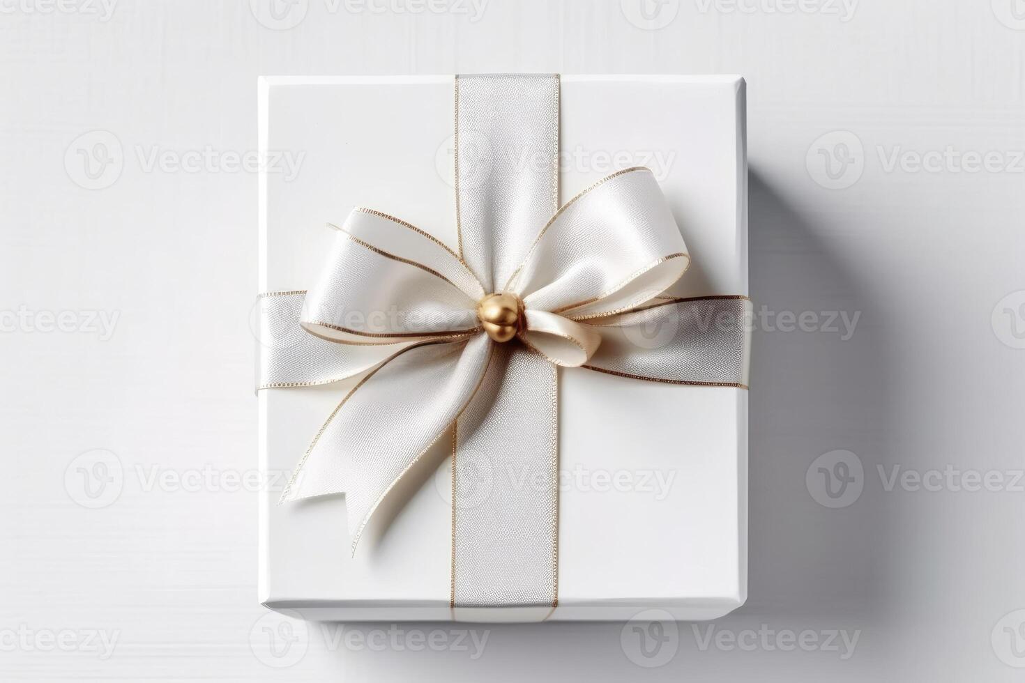 Gift box with satin ribbon and bow on white background photo