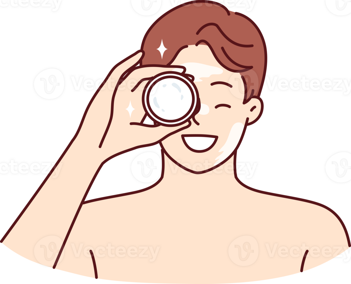 Man demonstrates jar of cream bought in cosmetic store to moisturize his face or get rid of wrinkles png