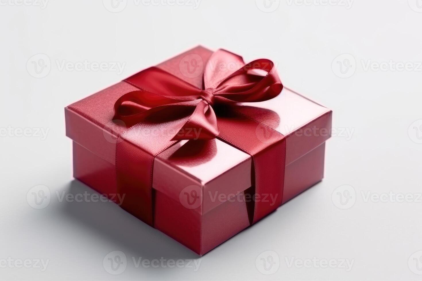 Gift box with satin ribbon and bow on white background photo