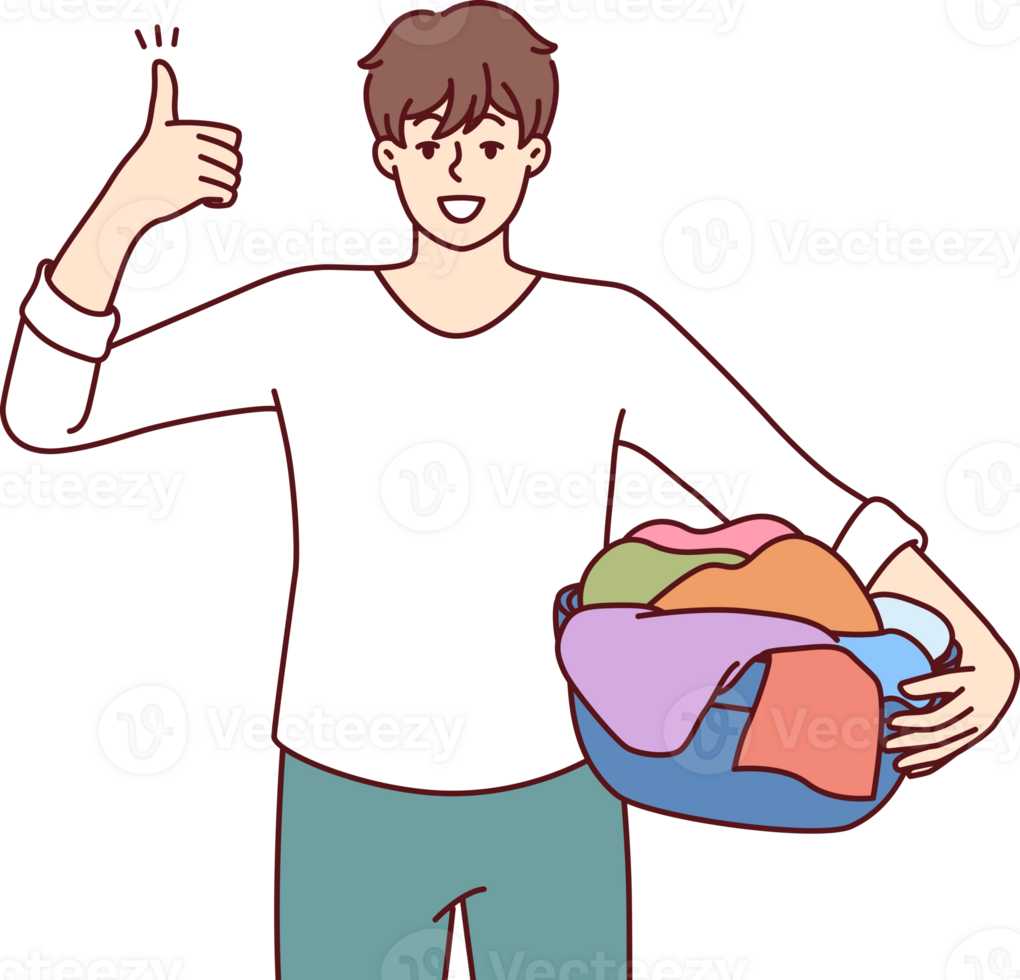 Man householder with laundry in basin shows thumbs up
