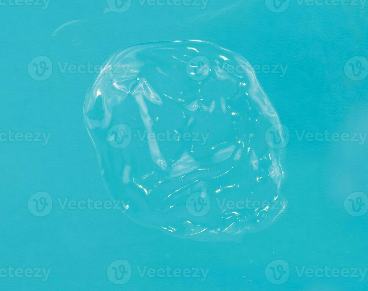 Transparent gel in blue background isolated photo