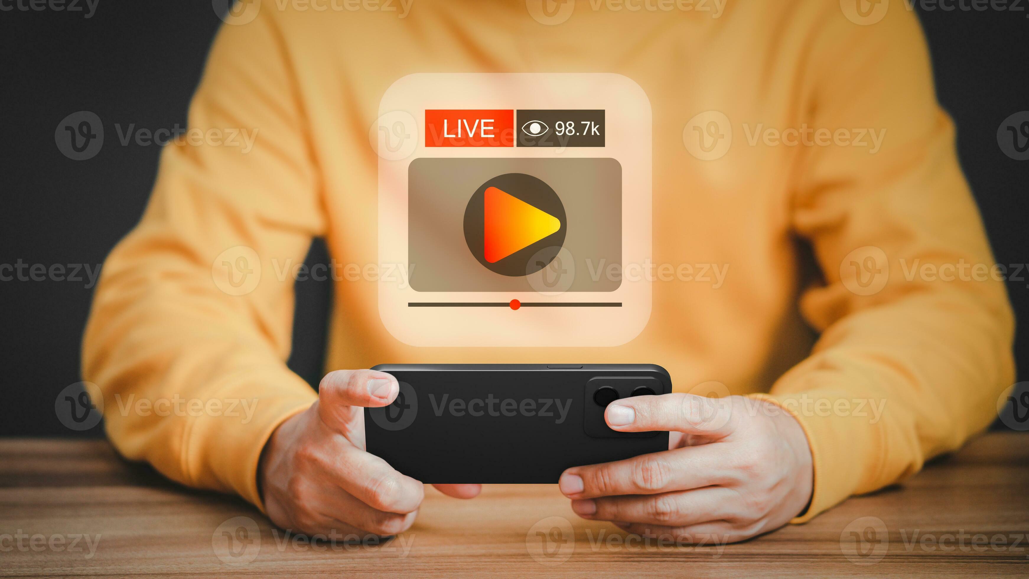Man using a smartphone or mobile phone for streaming online on virtual screen, searching video on internet, live football, show or tutorial, watching the movies, content online