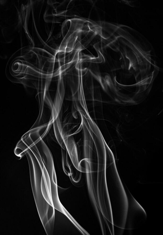 White smoke in a black background. smoke white light photo