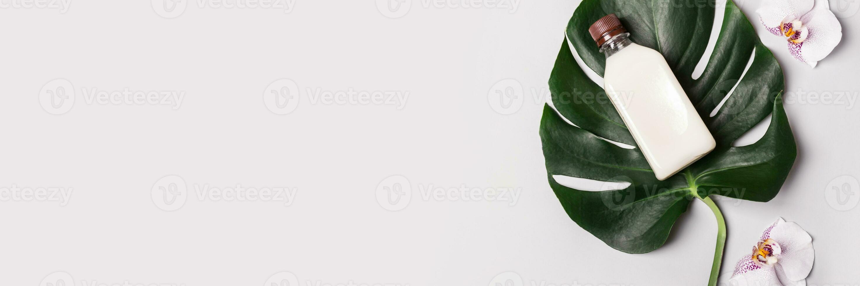 Coconut Oil or Cream, tropical leaves and flowers. Banner with Natural beauty spa product photo