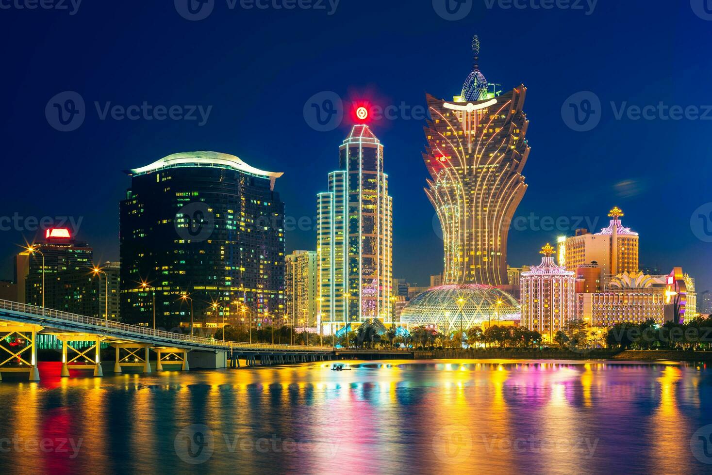 skyline of macau by the sea at night in china photo
