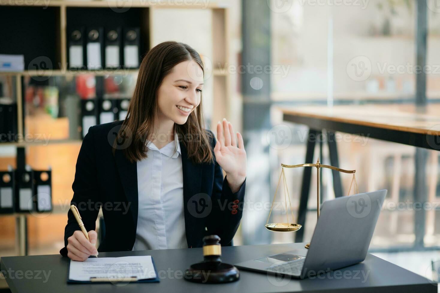 woman lawyer working and gavel, tablet, laptop in front, Advice justice and law concept. photo