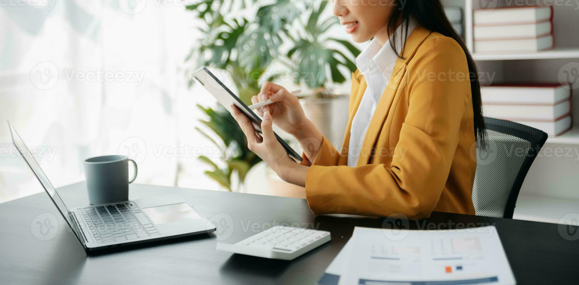 Businesswoman hand using laptop, tablet and smartphone in office. Digital marketing media mobile app and discussing plan new start up project. Finance task. photo