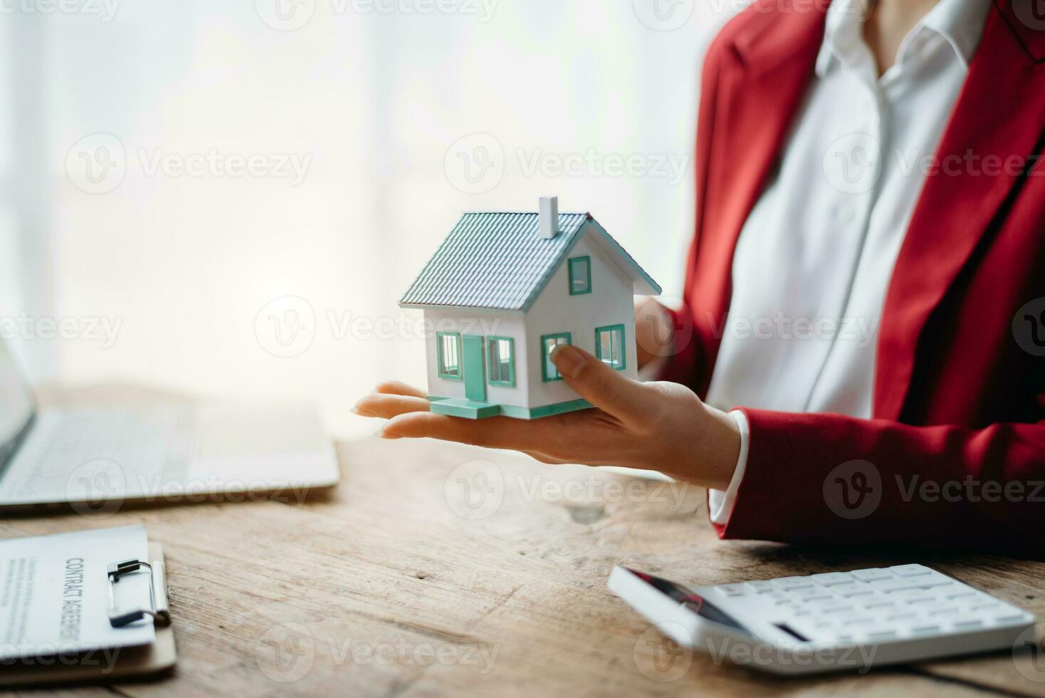 Signing a contract. Client and broker agent, lease agreement, successful deal and  Young business sitting at the desk in office photo
