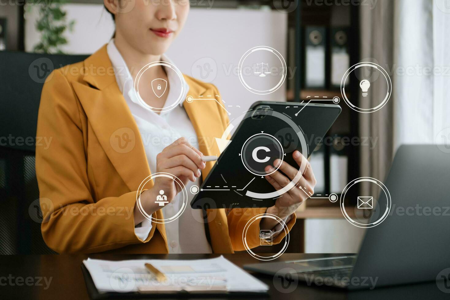 Copyright or patent concept, Person hand using laptop computer, tablet and smartphone with virtual screen copyright icon trademark, Creation ownership against piracy. photo