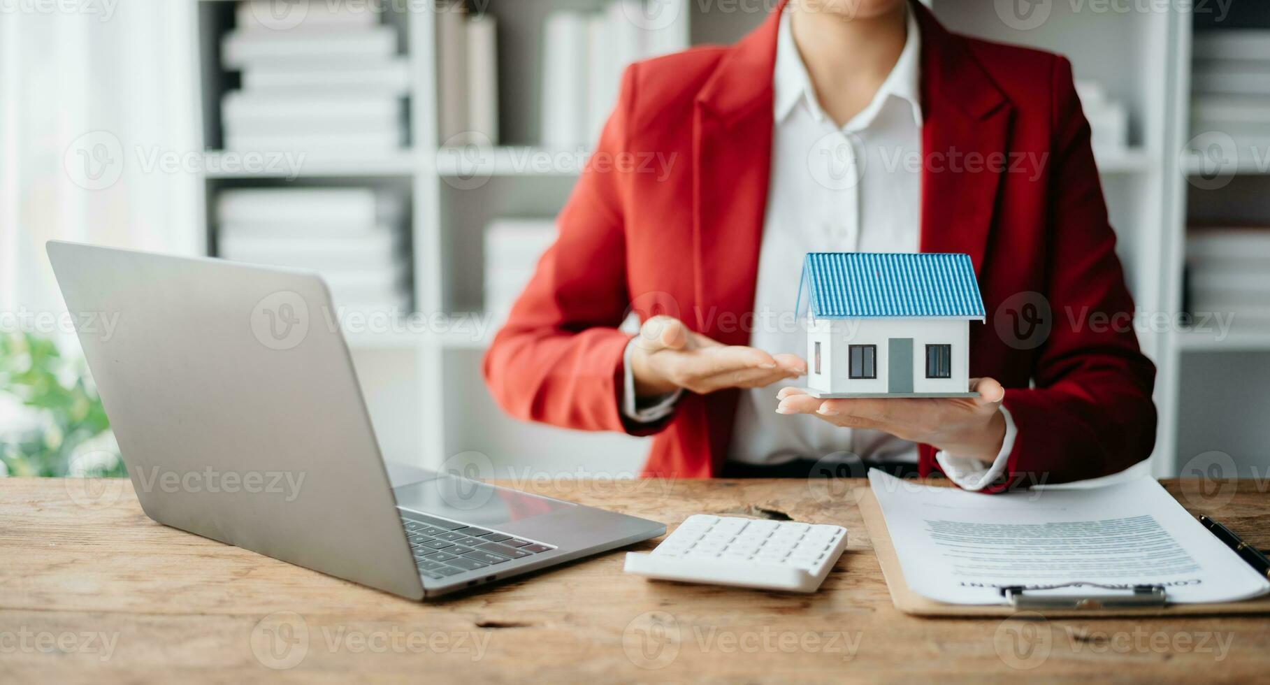 Signing a contract. Client and broker agent, lease agreement, successful deal and  Young business sitting at the desk in office photo
