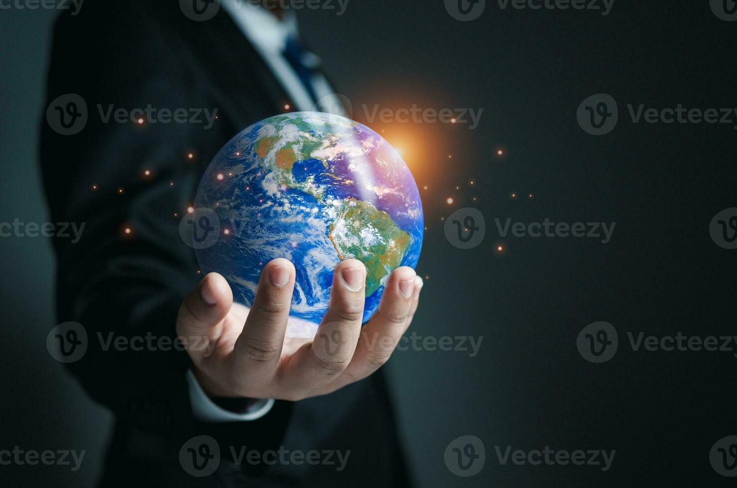 Businessman holding a model globe. concept of network communication. information network concept. photo