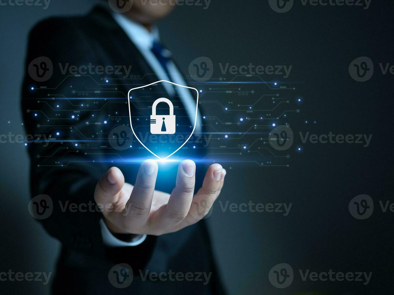 Businessman holding a protection sign. Represents protection against external hacks. Concepts of protection against code, viruses, firmware and malware. photo