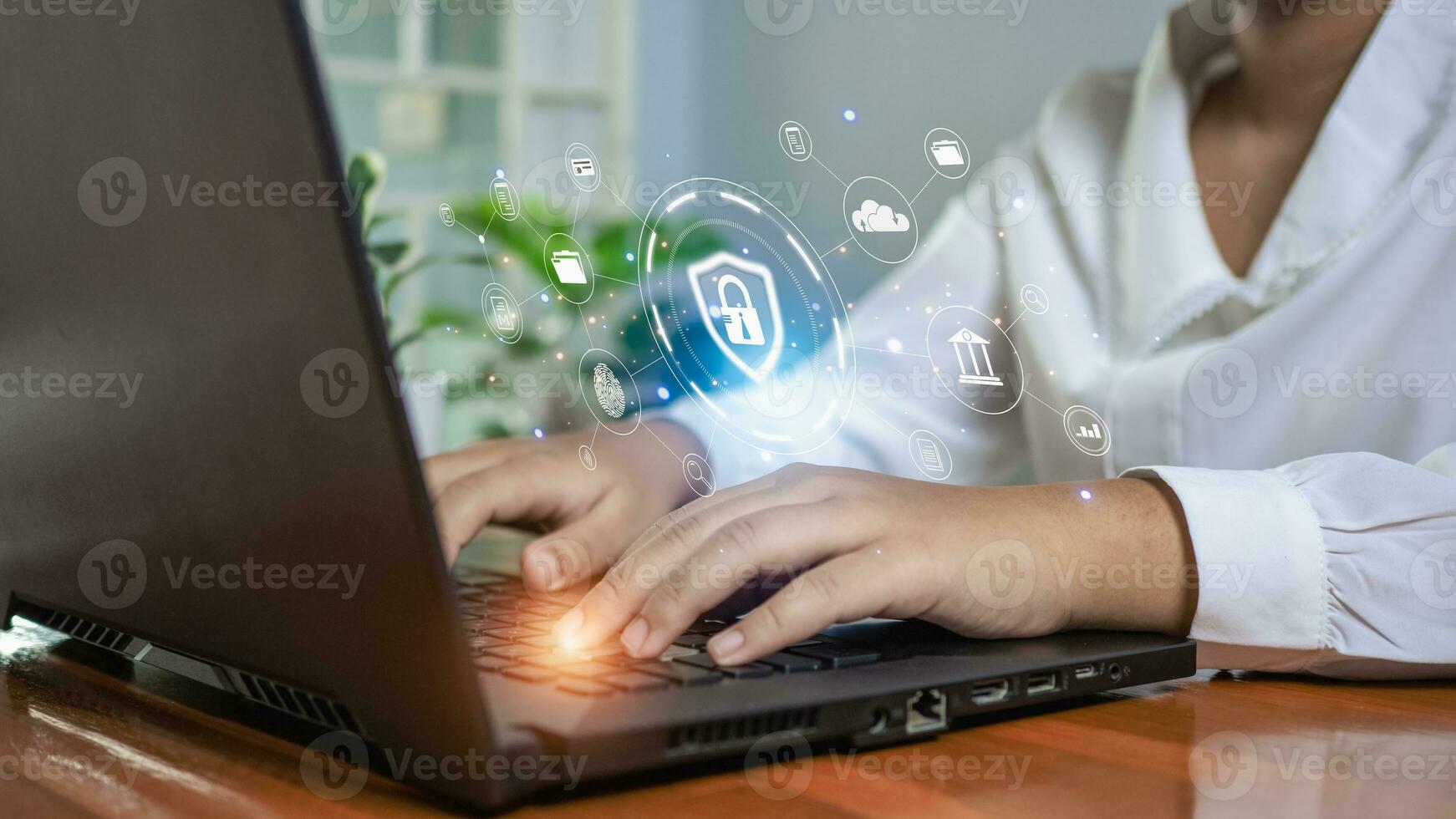 Human hand working on computer and protection icon. Represents the code protection. Security concept and communication technology photo