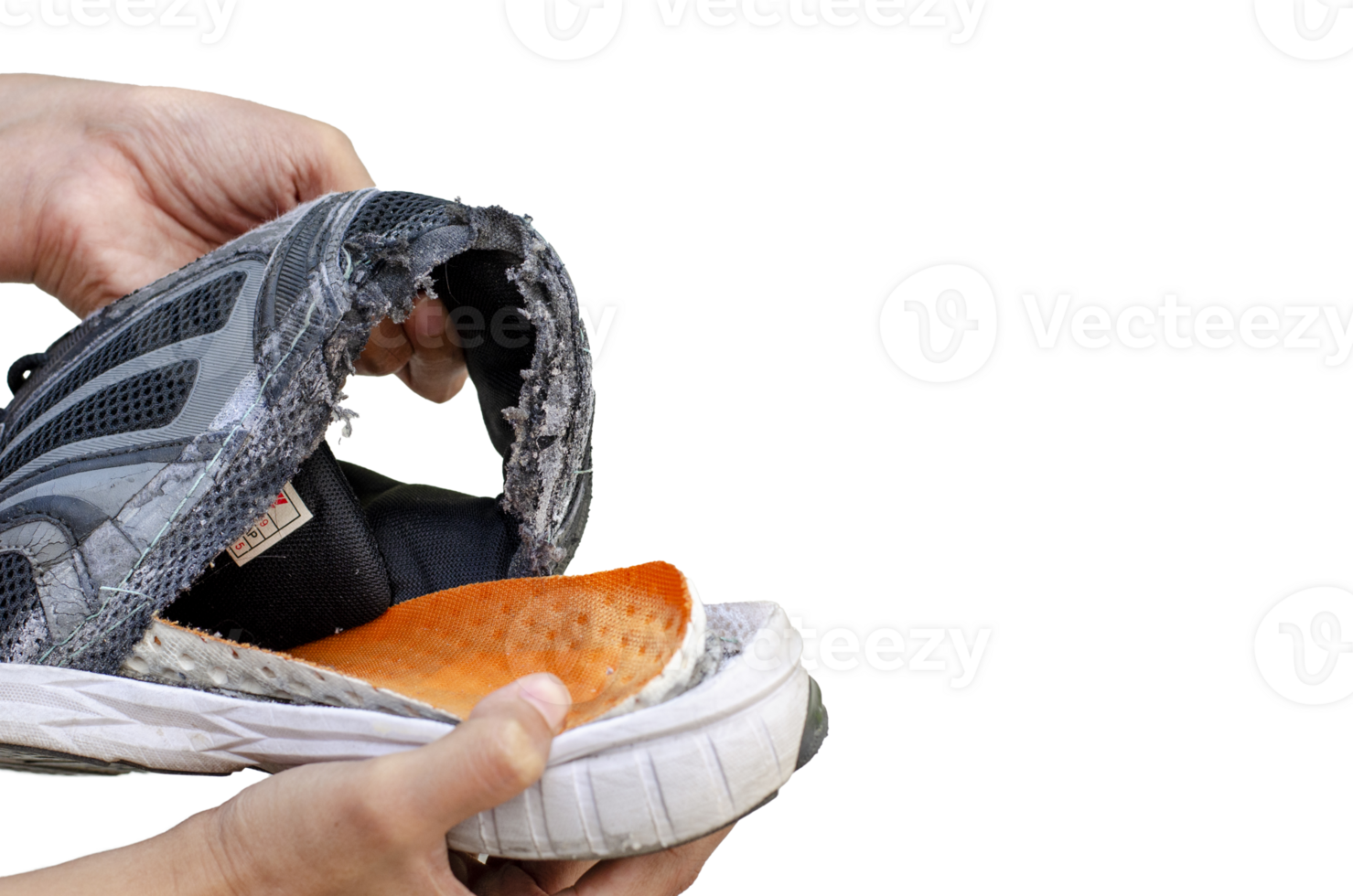 Hand holding an old, broken black shoe behind the heel of the shoe on transparent background png