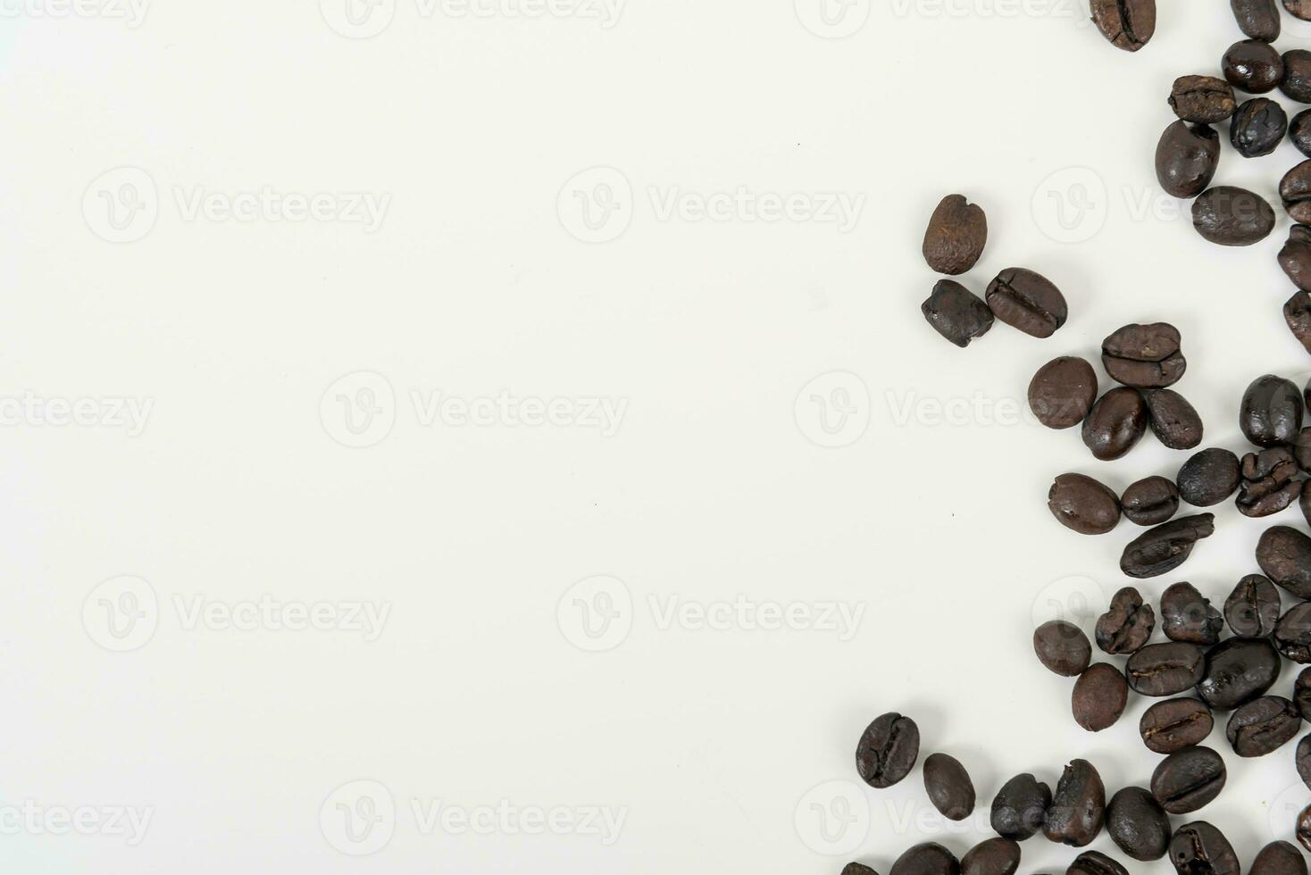 top view of coffee beans on white table photo