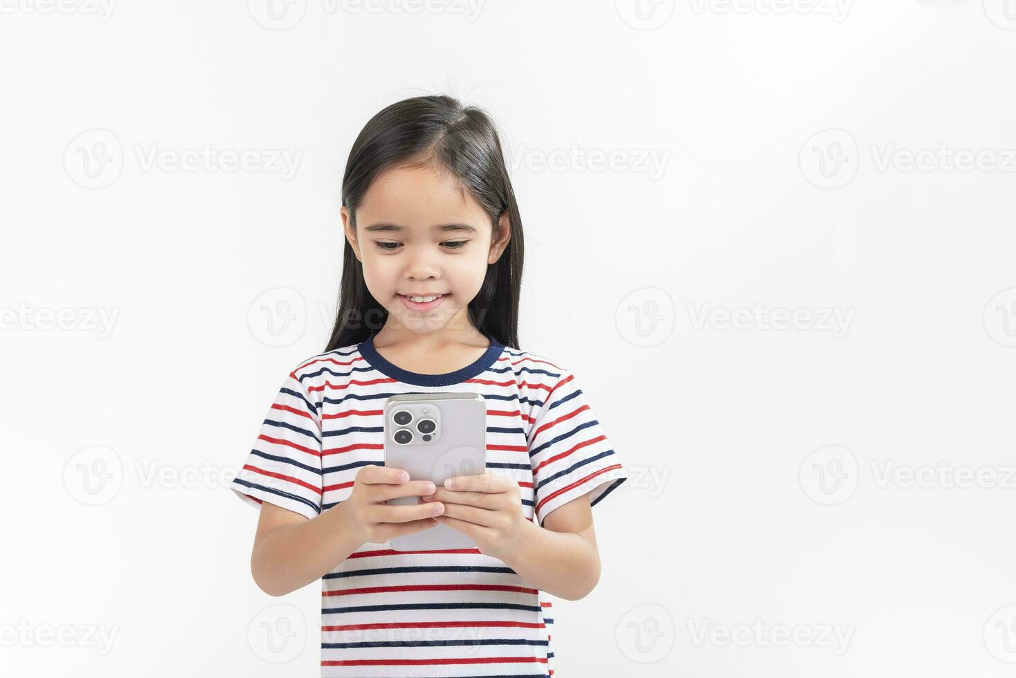 Little girl play phone mobile. Isolated on white background photo