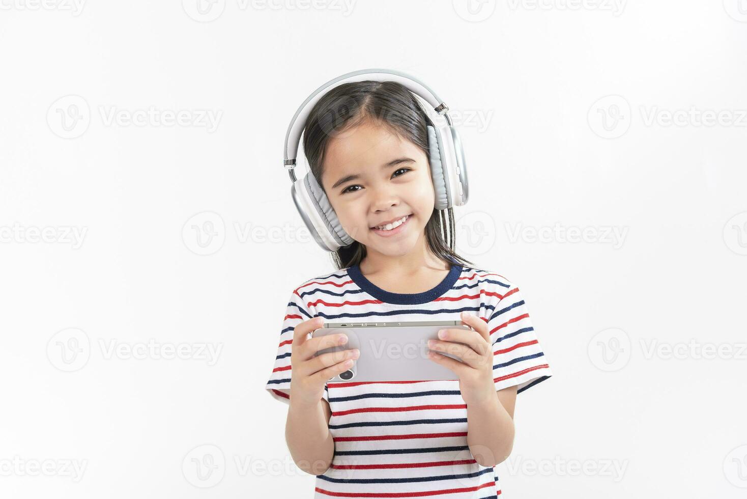 Little girl play phone mobile. Isolated on white background photo