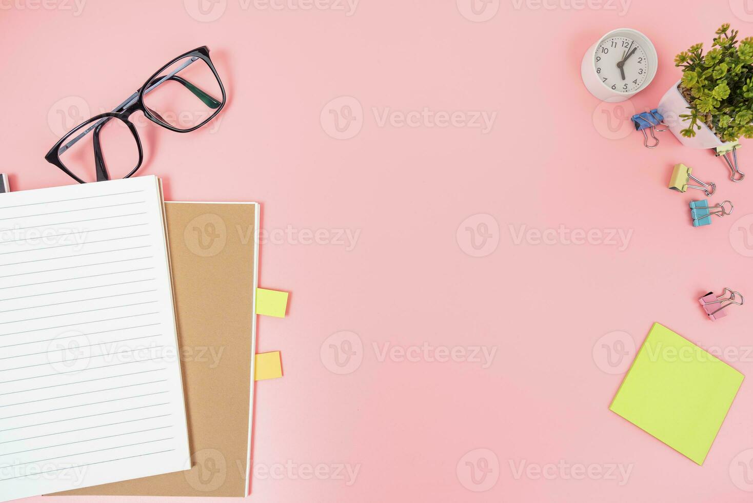 Pink office desk table Top view with copy space. Flat lay. photo