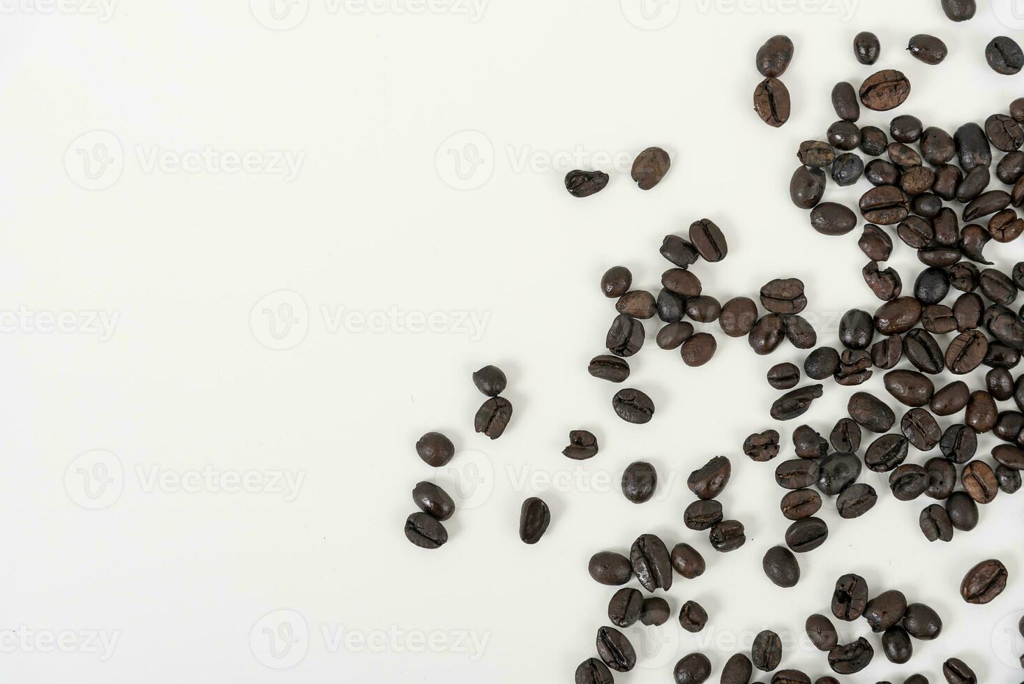 top view of coffee beans on white table photo