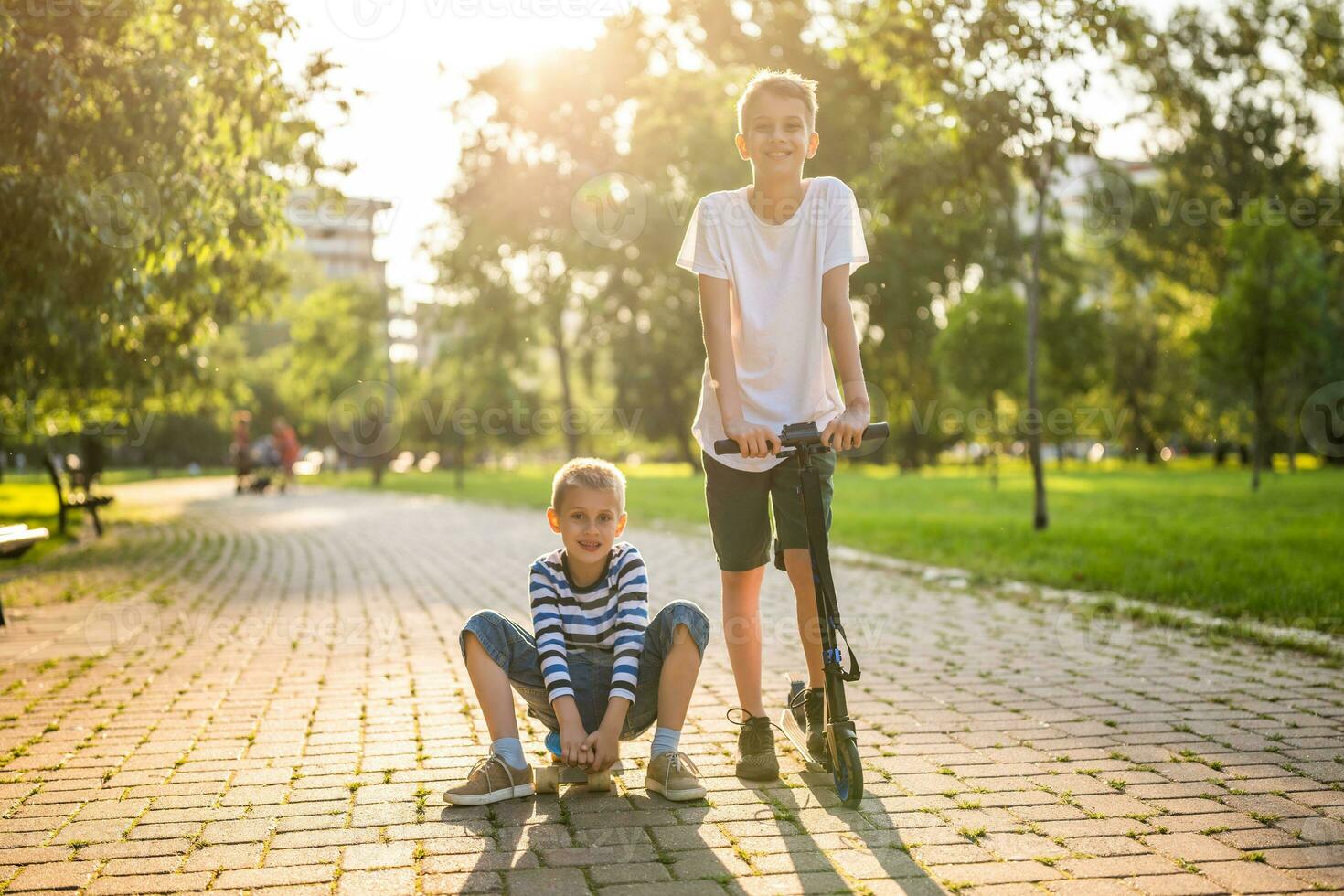 Little brothers playing in the park photo
