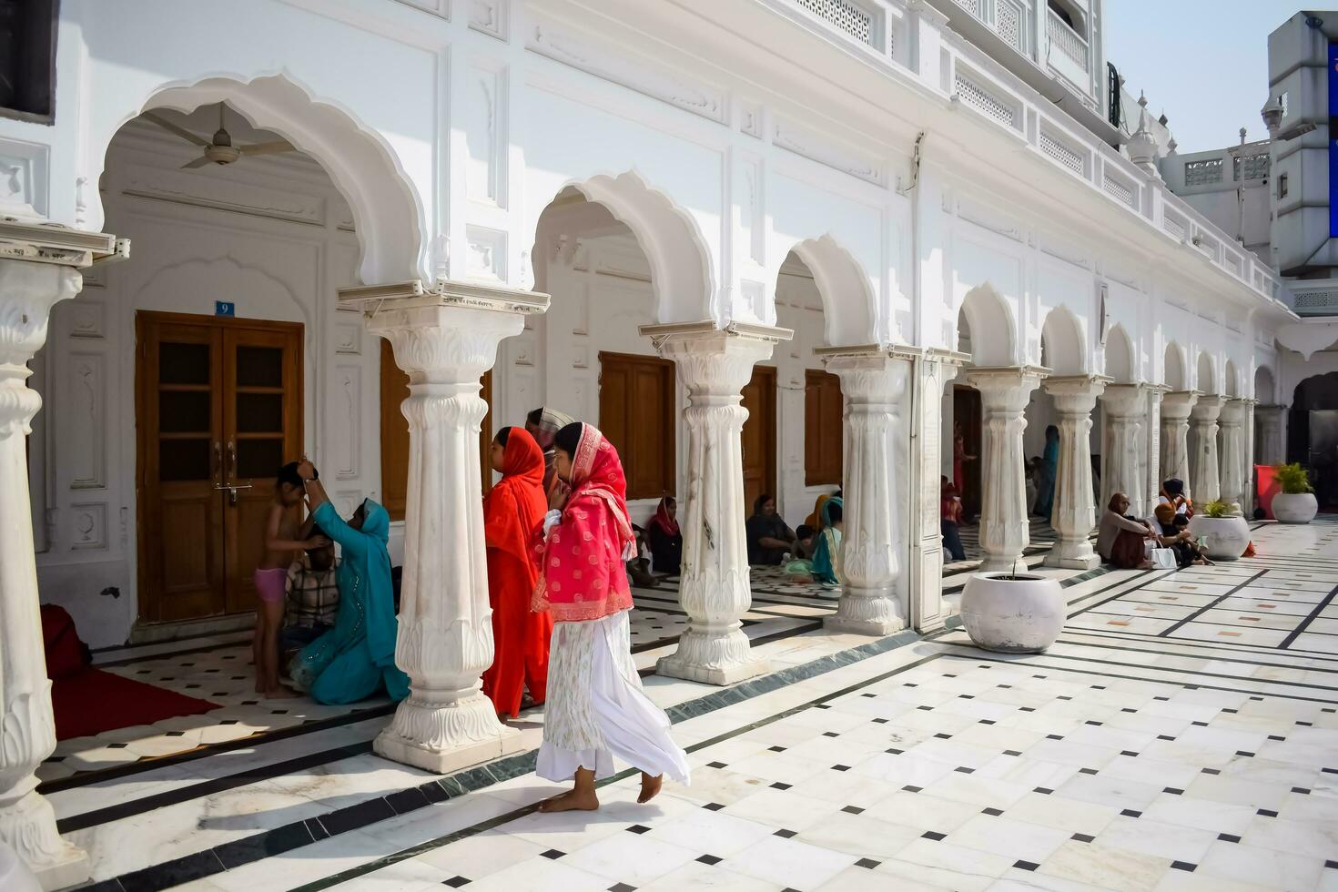 Amritsar, India - February 26 2023 - Unidentified devotees from various parts at Golden Temple - Harmandir Sahib in Amritsar, Punjab, India, Famous indian sikh landmark, Golden Temple photo