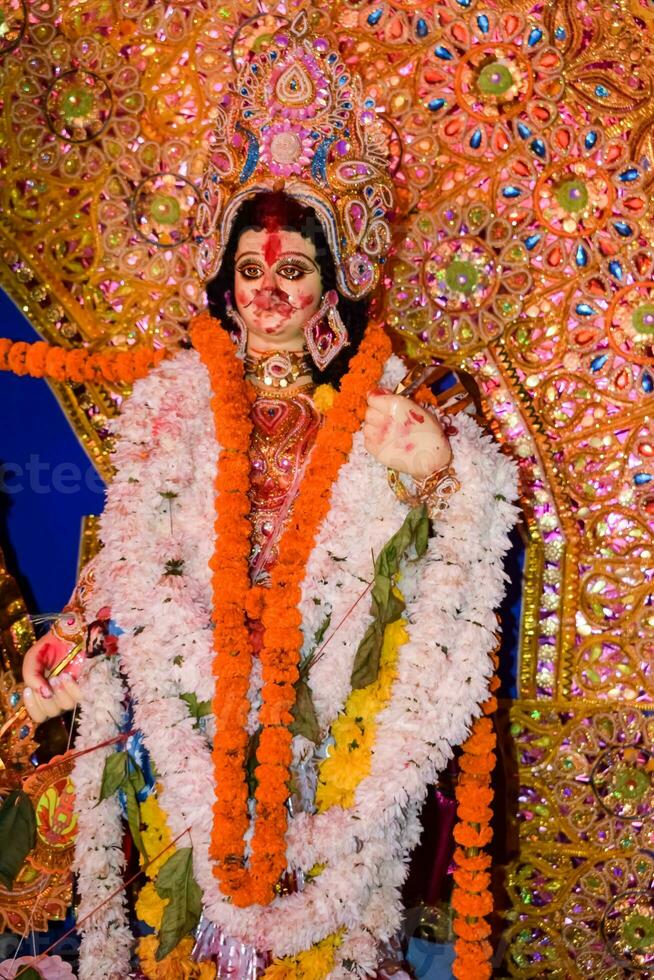 Goddess Durga with traditional look in close up view at a South Kolkata Durga Puja, Durga Puja Idol, A biggest Hindu Navratri festival in India photo