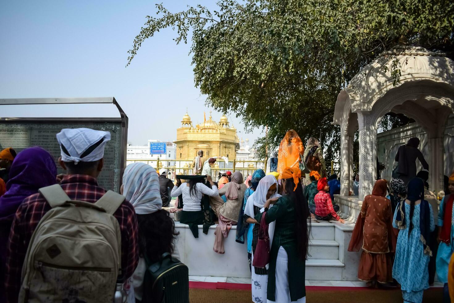 Amritsar, India - February 26 2023 - Unidentified devotees from various parts at Golden Temple - Harmandir Sahib in Amritsar, Punjab, India, Famous indian sikh landmark, Golden Temple photo