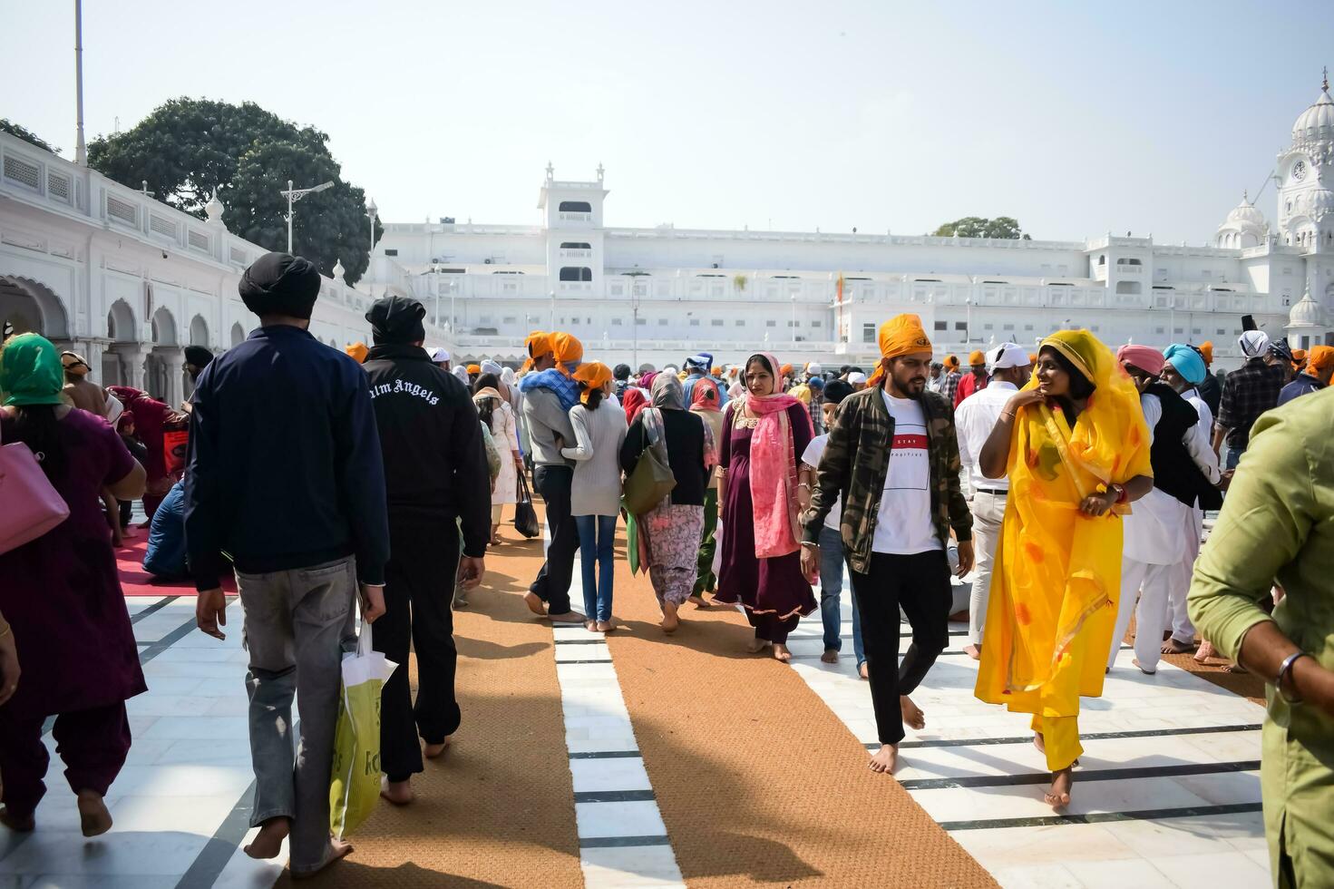 Amritsar, India - February 26 2023 - Unidentified devotees from various parts at Golden Temple - Harmandir Sahib in Amritsar, Punjab, India, Famous indian sikh landmark, Golden Temple photo