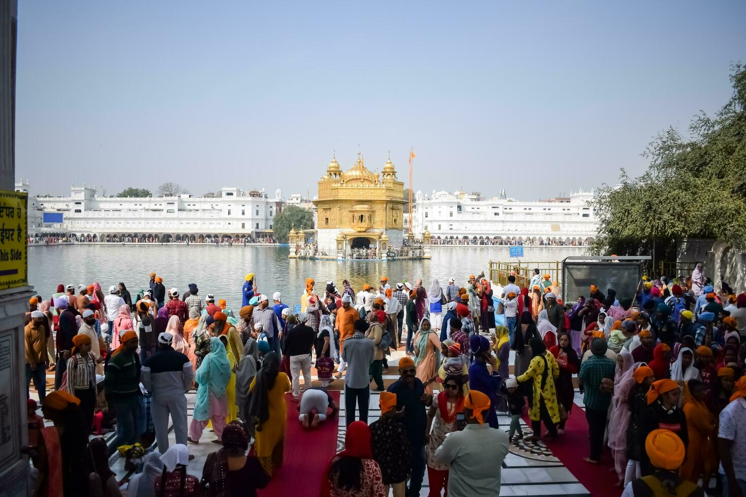Amritsar, India - February 26 2023 - Unidentified devotees from various parts at Golden Temple - Harmandir Sahib in Amritsar, Punjab, India, Famous indian sikh landmark, Golden Temple photo