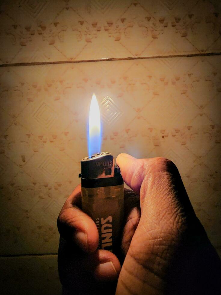 A Fiery lighter Glow in Darkness photo
