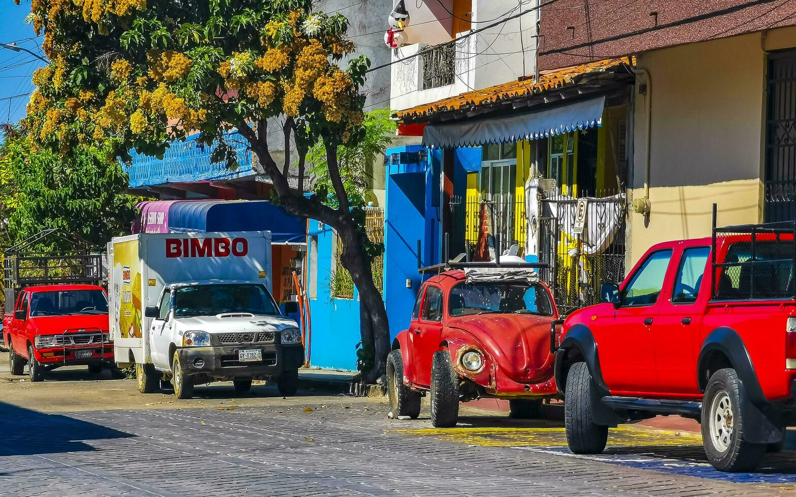 Puerto Escondido Oaxaca Mexico 2023 Typical beautiful colorful tourist street sidewalk city Puerto Escondido Mexico. photo